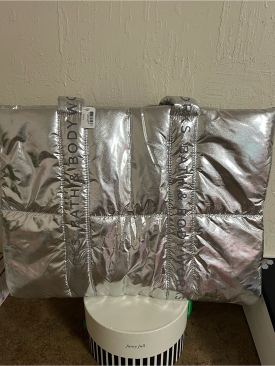 Bath & Body Works Handbags - Bath & Body Works Metallic Silver Puffer Tote